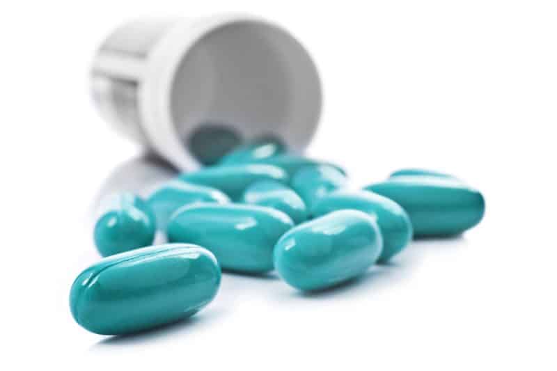 Blue pills an pill bottle